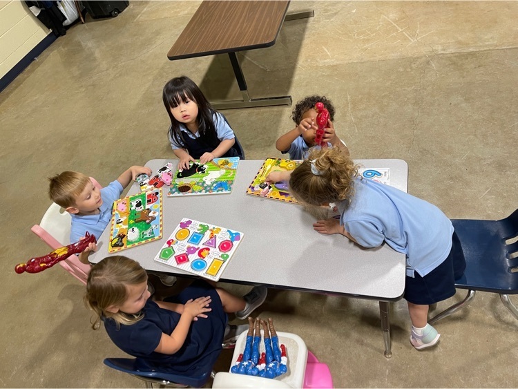 Immaculate Heart of Mary School Pre-K3 students doing puzzles during indoor recess  
