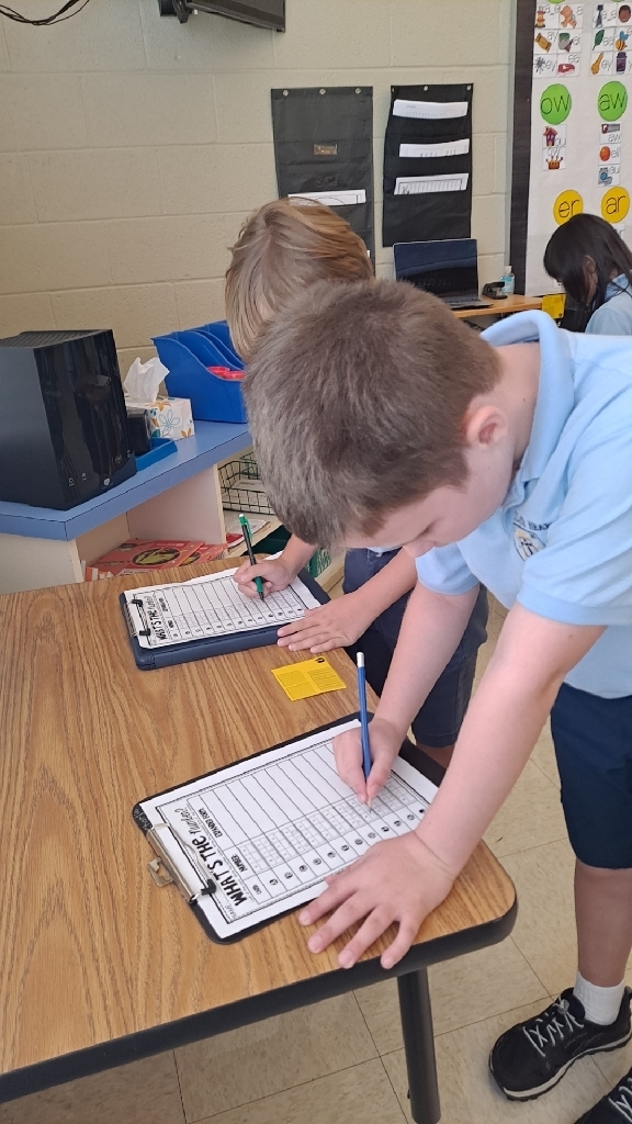 two students work on math problems 