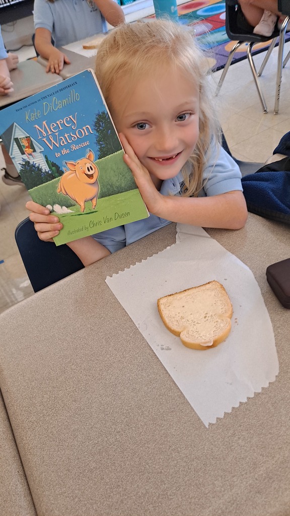 2nd graders with a Mercy watson book and buttered toast