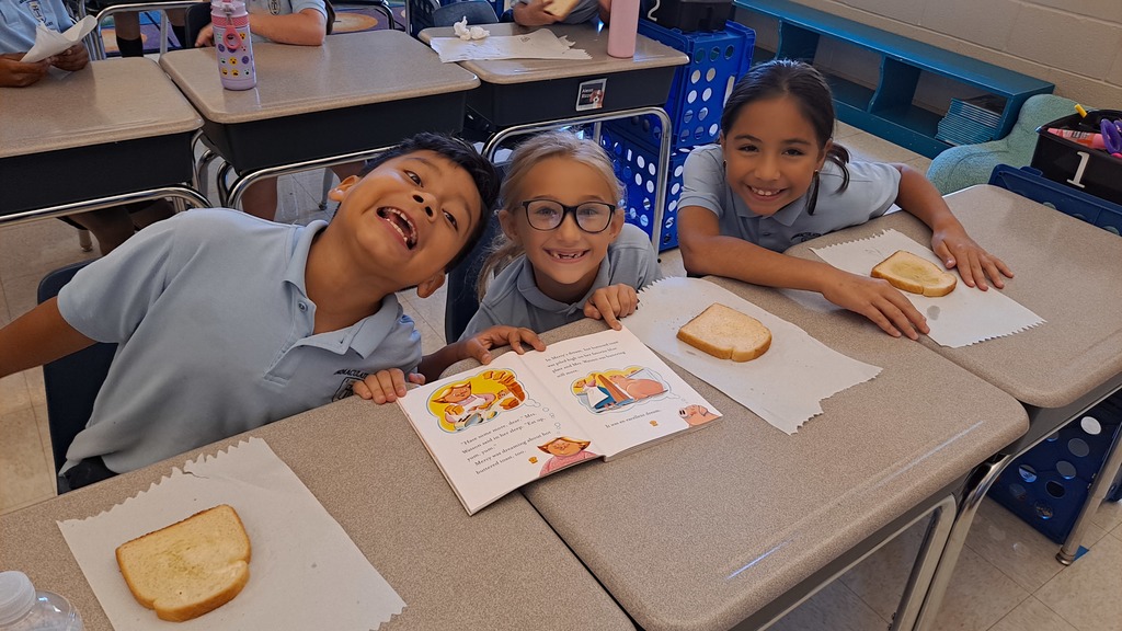 2nd graders with a Mercy watson book and buttered toast