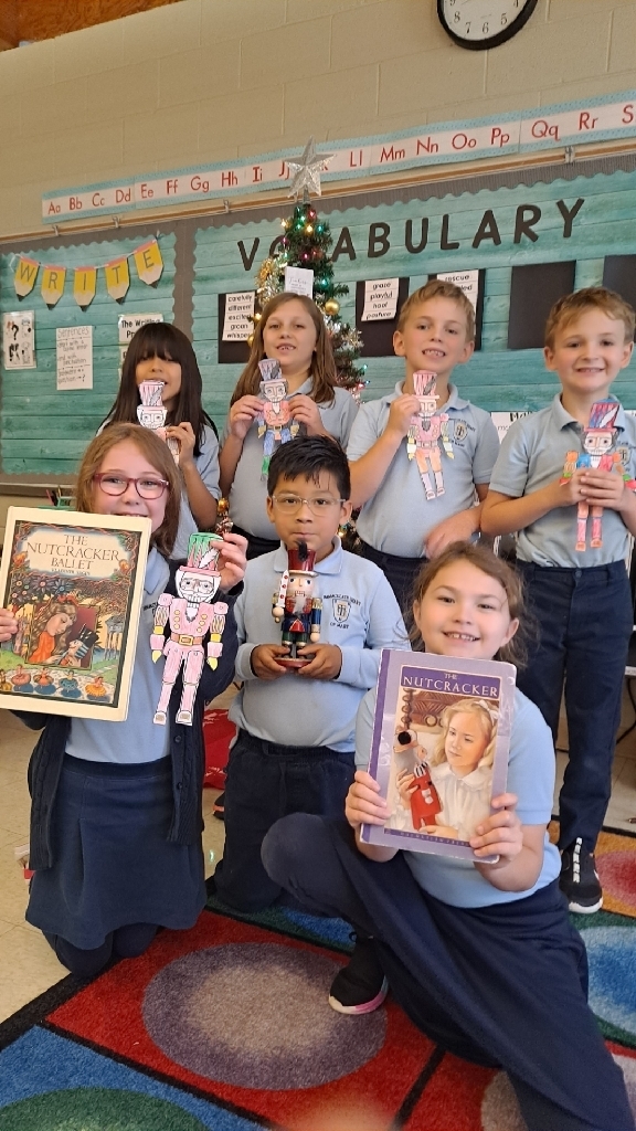 2nd graders holding nutcrackers