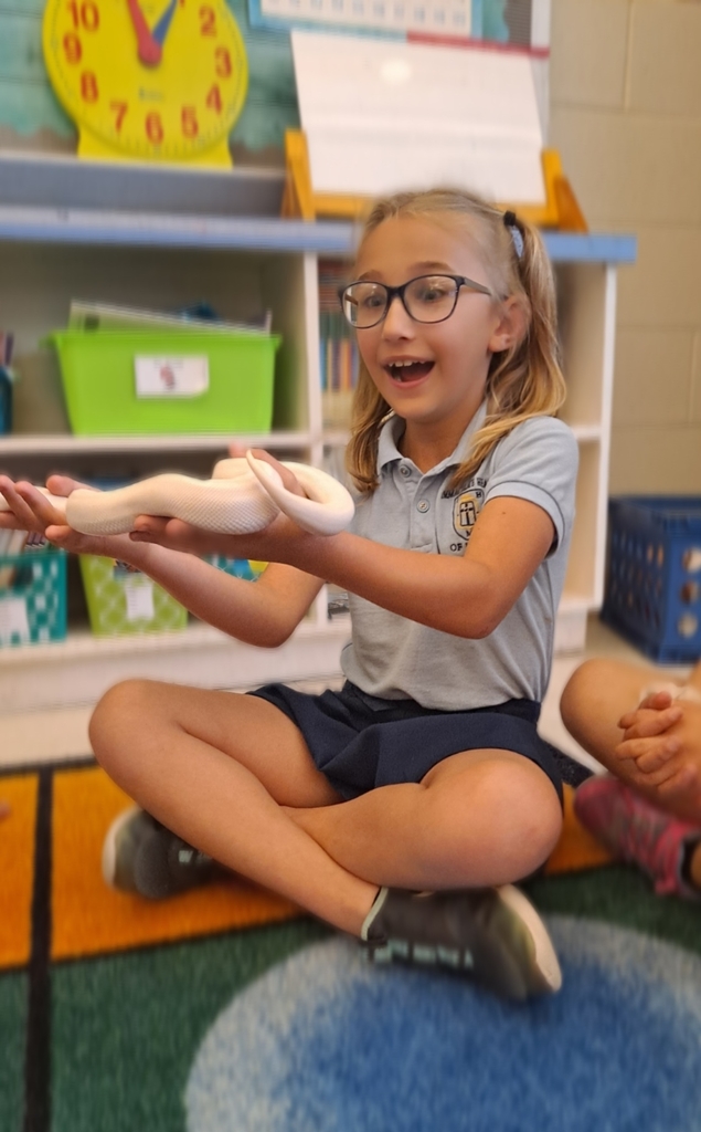 2nd graders holding a snake